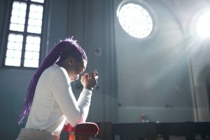 Woman praying in the church